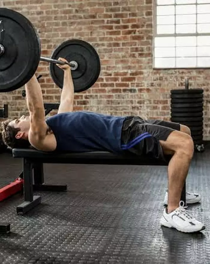Person performing a deadlift in the gym